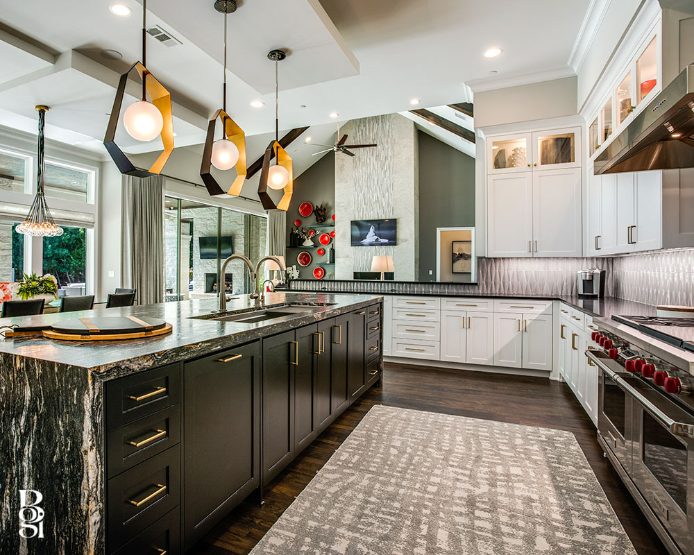gorgeous dark marble countertops with white fabric barstools and accent lighting