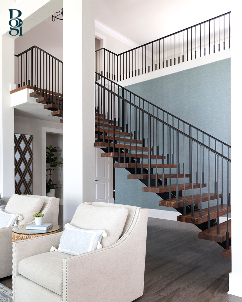 modern floating staircase with a turquoise side wall 