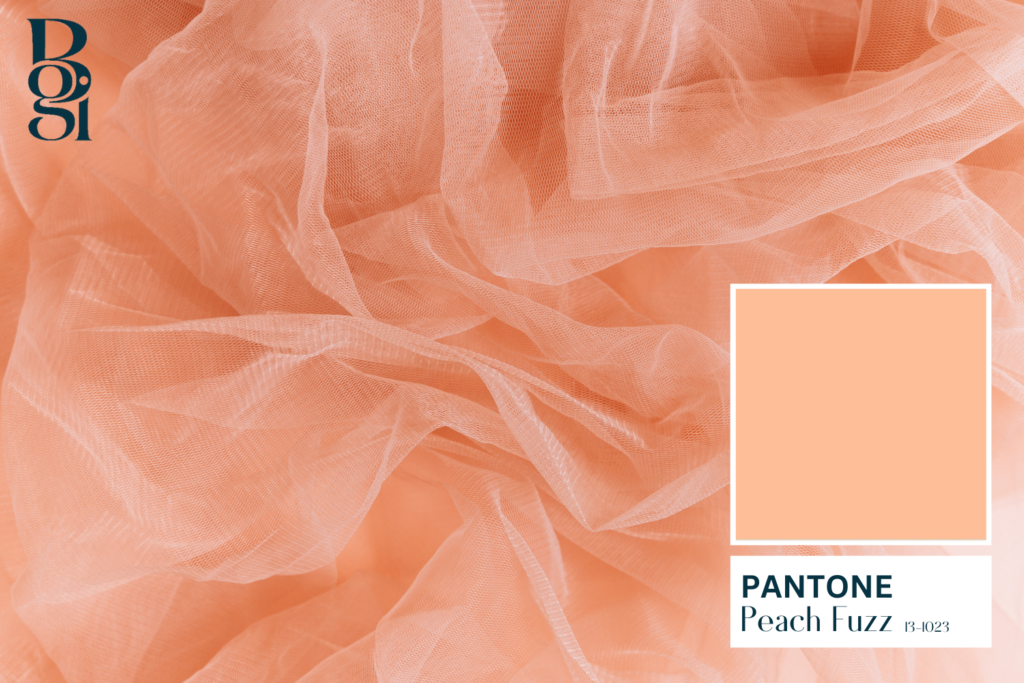 Peach Fuzz 13-1023 is Pantone's color of the year with Peach Fuzz colored tule in the background