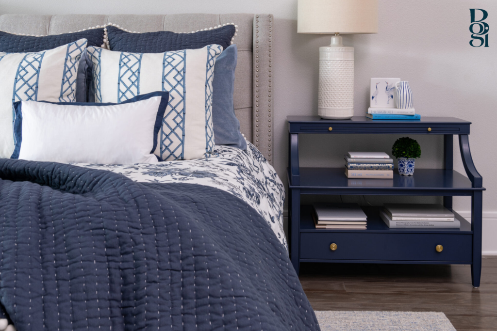 modern farmhouse bedroom with navy accents and rounded nightstand